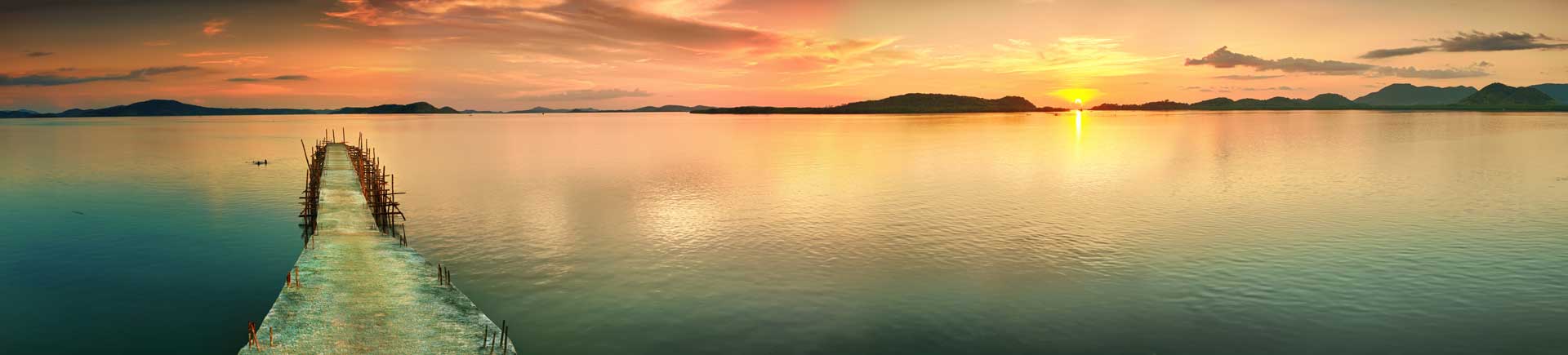 Sunset,Over,The,Sea.,Pier,On,The,Foreground.,Panorama Sunset over the sea. Pier on the foreground. Panorama